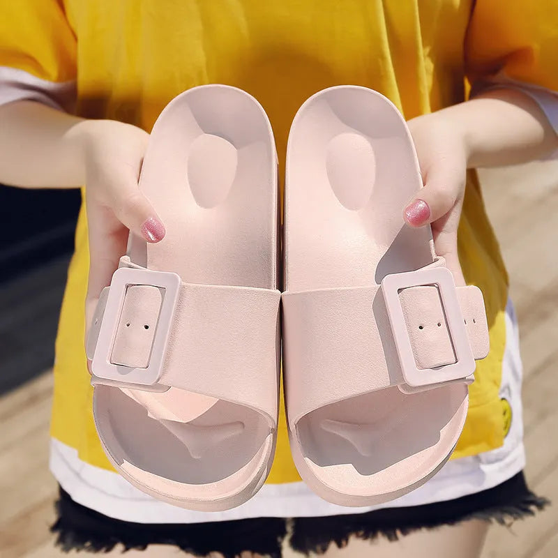 Women's EVA buckle fastening flip-flop slippers in assorted colours showing soft sole design
