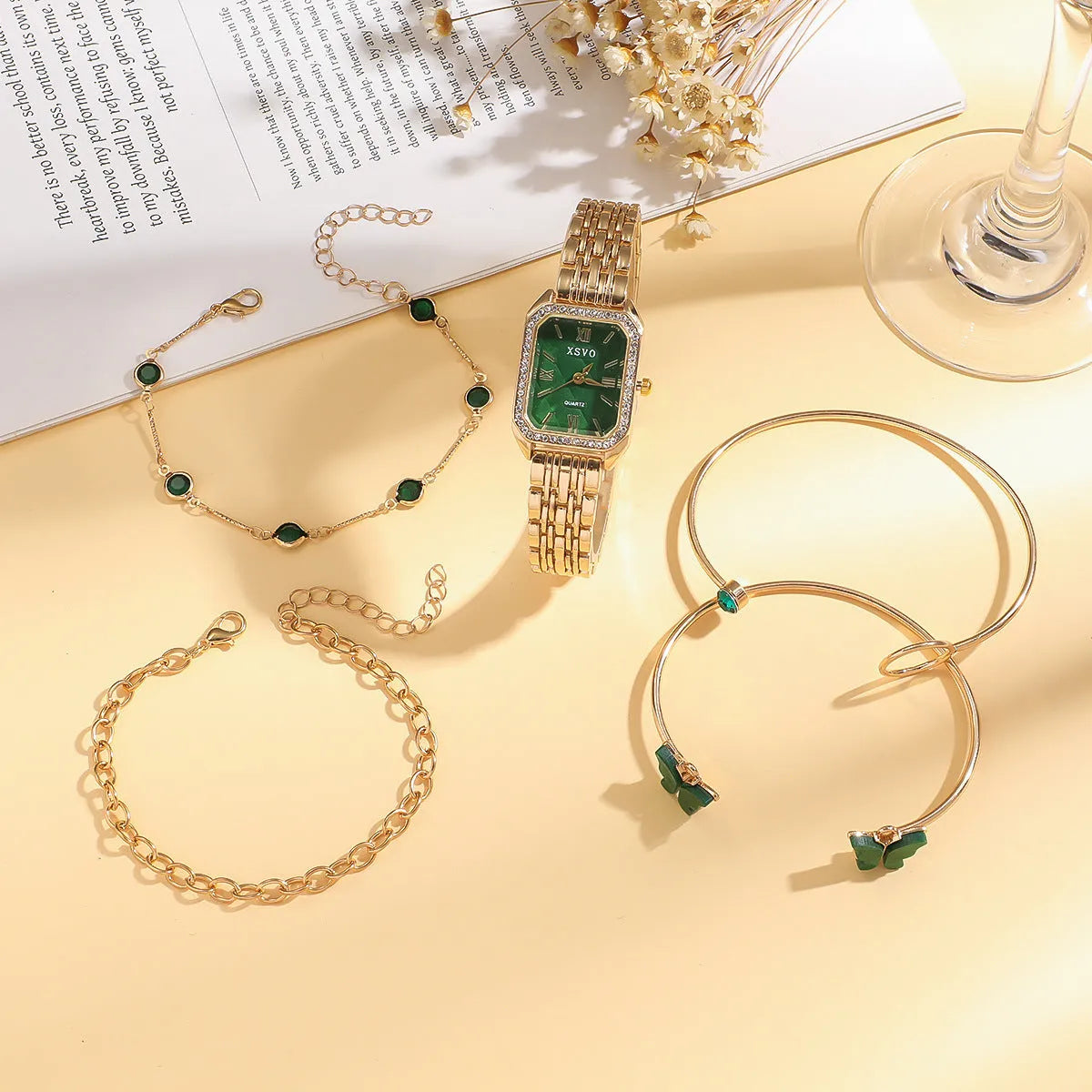 Gold green square dial women's watch with four matching alloy bracelets featuring jewellery buckle closures
