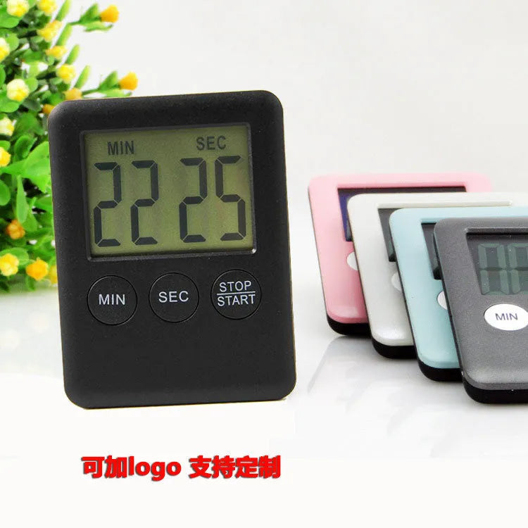 Digital kitchen timer with magnetic back and LCD display showing countdown time