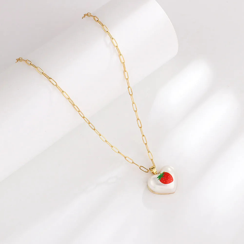 Adjustable heart-shaped necklace with fruit pendant charm showing five colour options