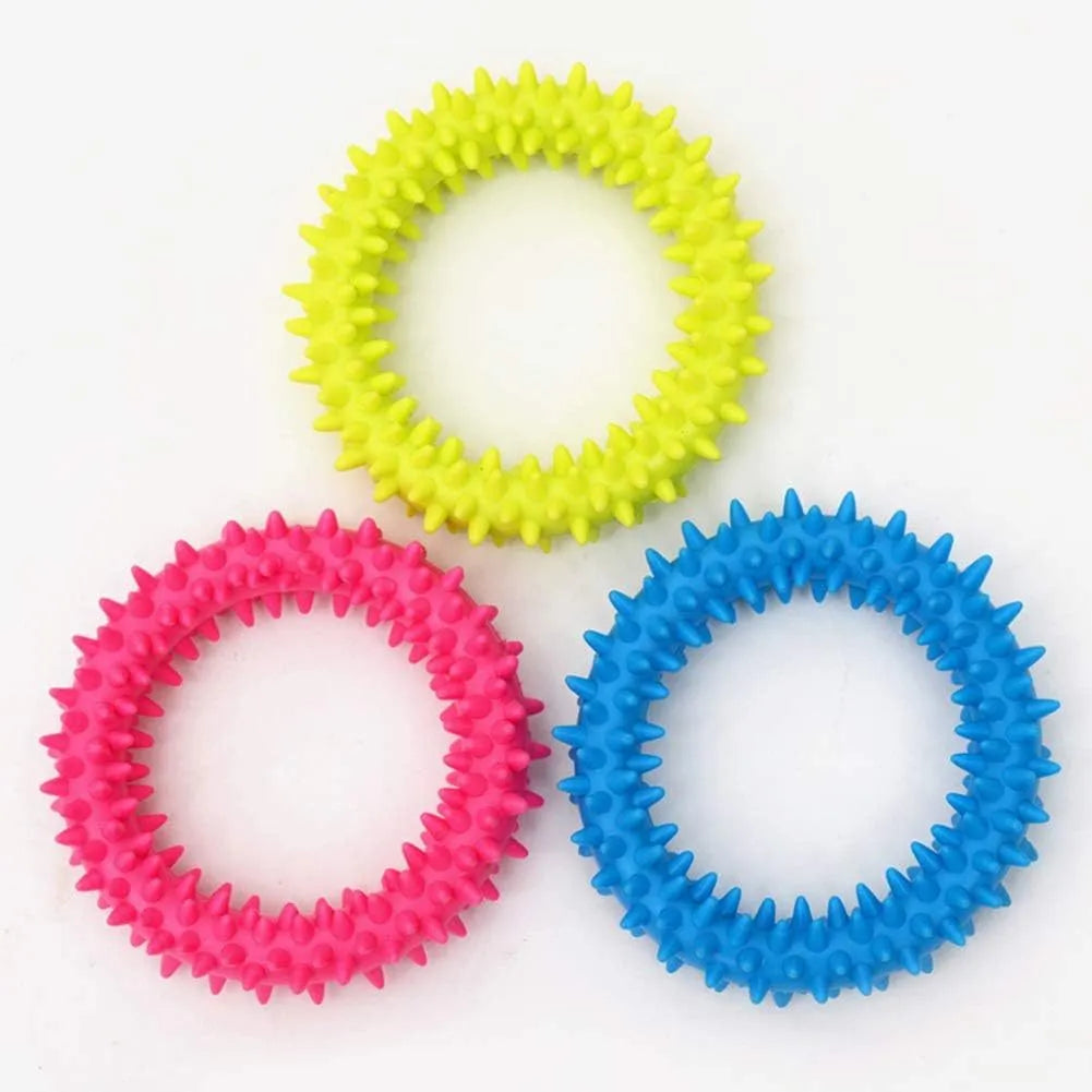 TPR spiky circle ring dog chew toy in various colours showing textured dental cleaning nubs