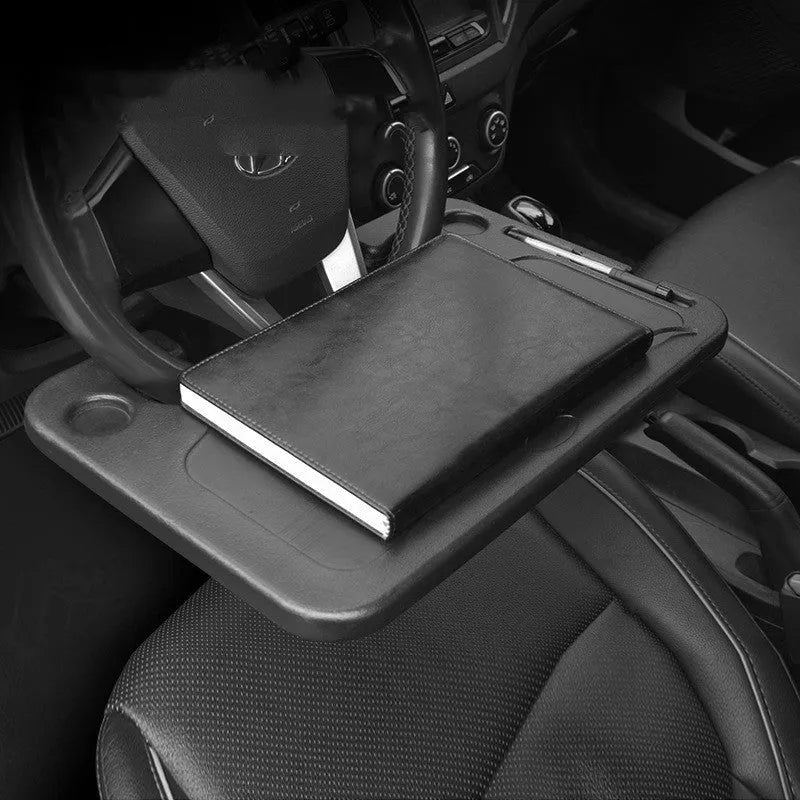 Black plastic car desk with computer workspace and integrated plate storage compartments
