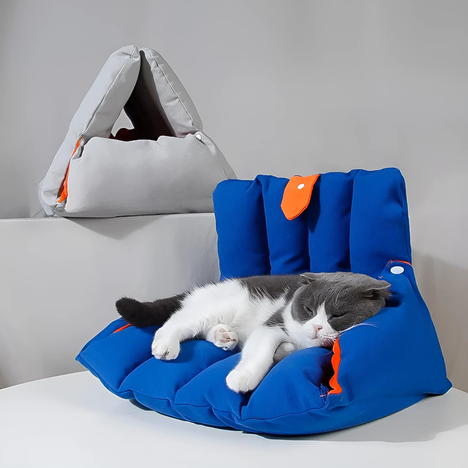 Blue triangular cotton cat nest bed with drilled holes for combination.