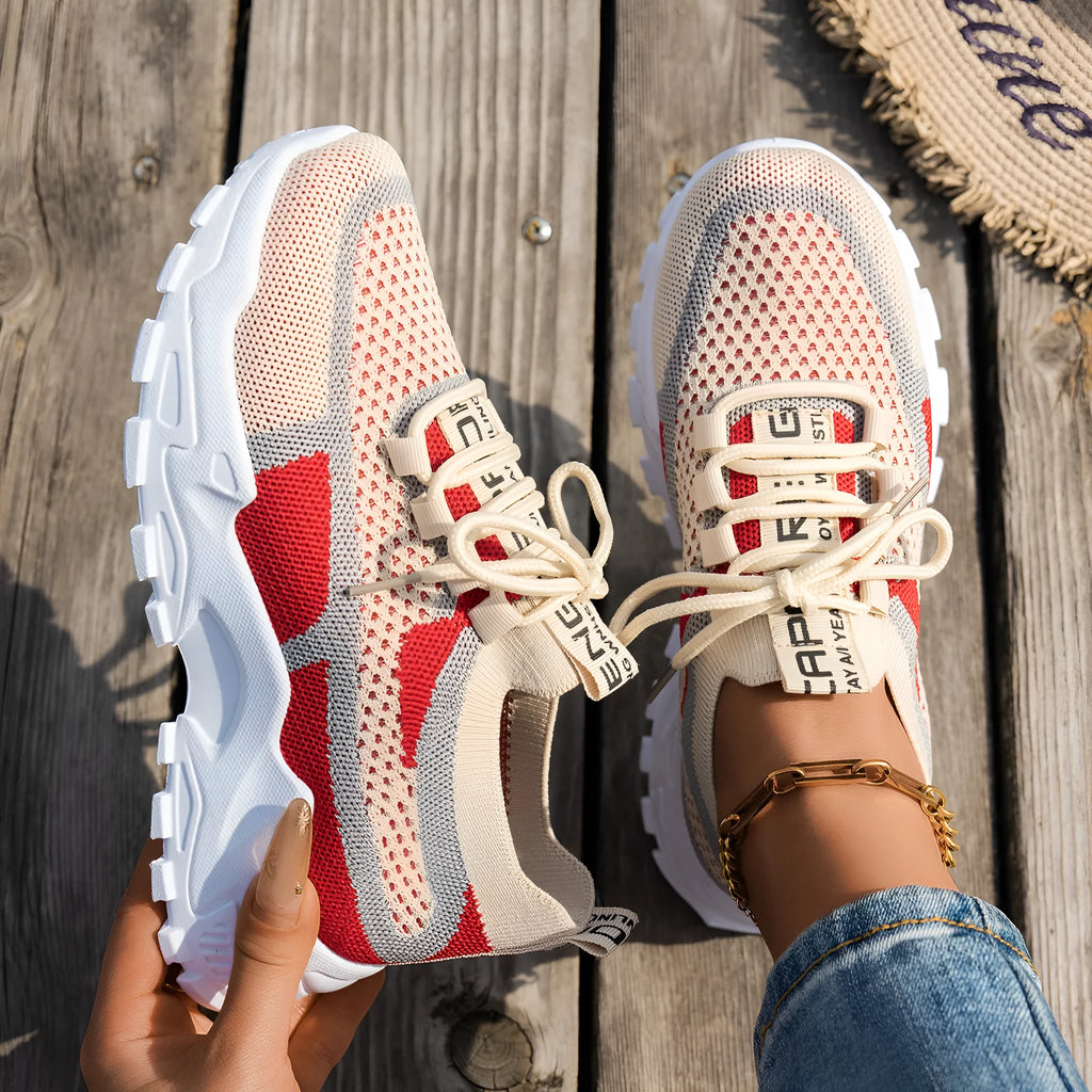 Women's Flyknit mesh lace-up sneakers in a multi-tone colourway with a low rubber sole.