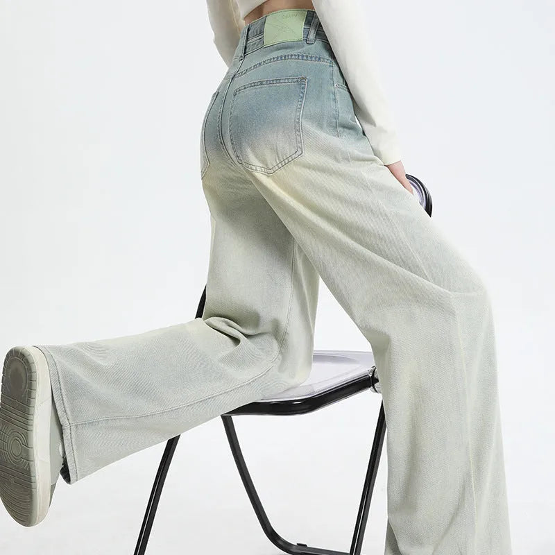 Women's gradient blue straight-leg denim trousers with wide leg design showing colour transition effect