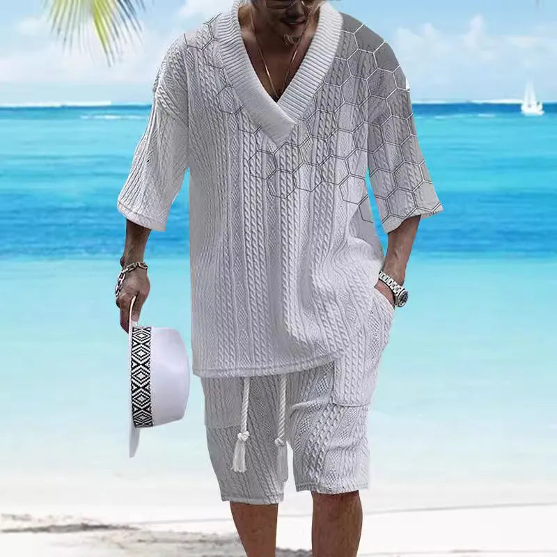 Man wearing a printed drop-shoulder knitted short-sleeve top with matching shorts, a casual loungewear set.