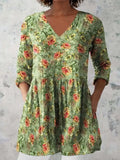 Women's loose fitted printed wave dress with 3/4 sleeves and wide waistband on hanger