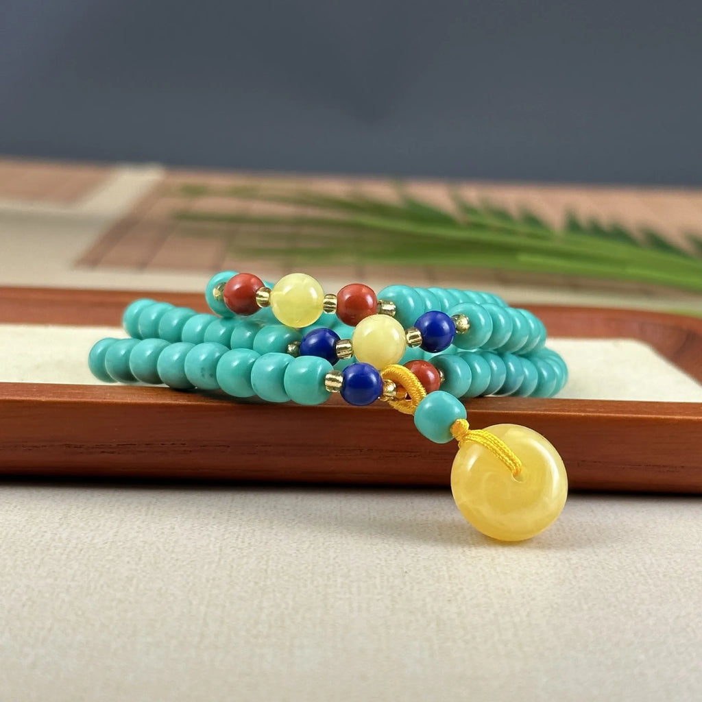Hand-woven turquoise mesh flower pendant necklace on ball bead chain with adjustable length