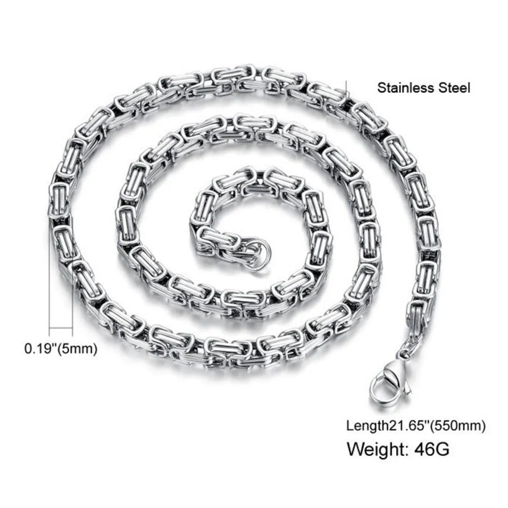 Stainless steel punk necklace with 5mm chain in steel finish on black background
