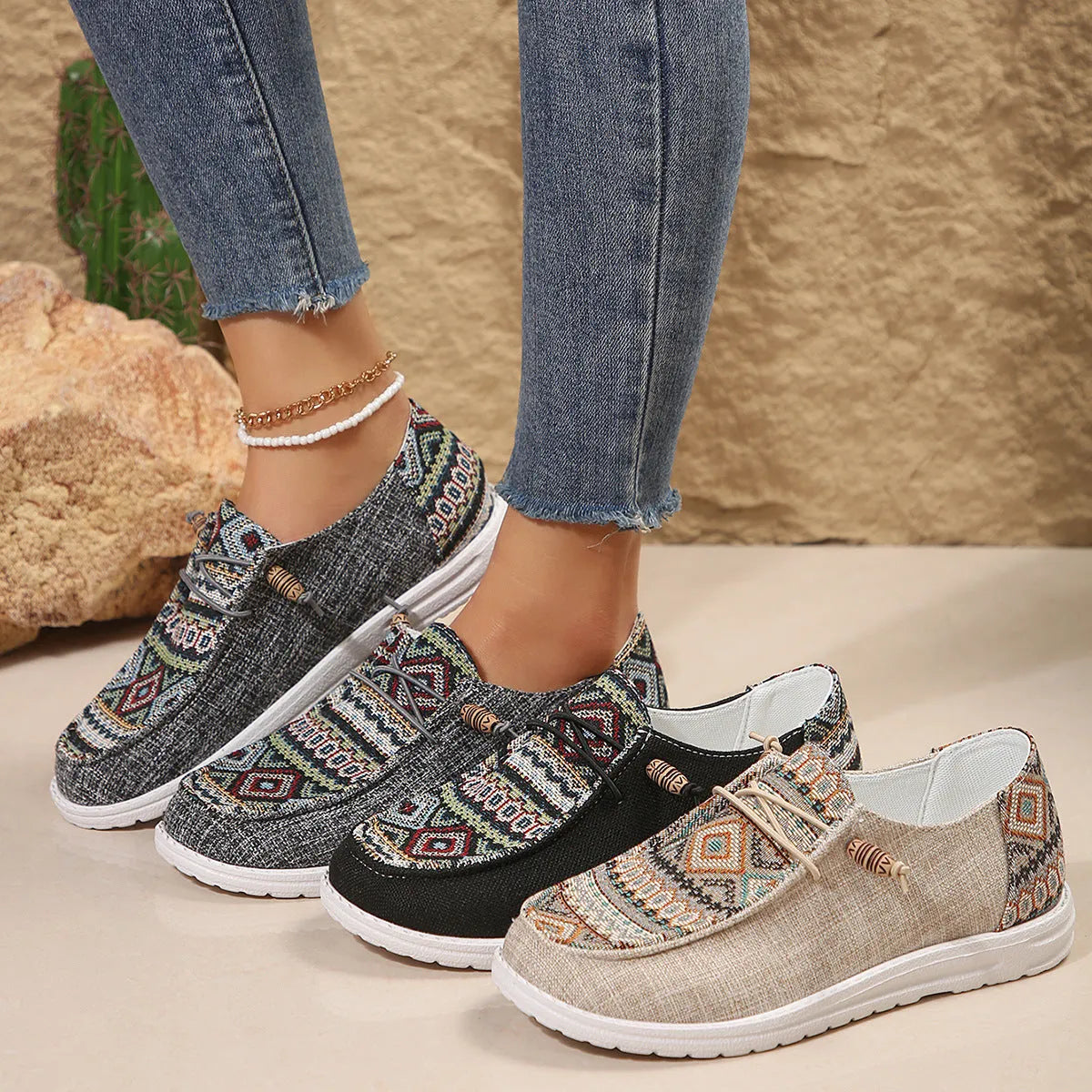 Women's low-top flat slip-on shoes in black, dark grey, or khaki with a round toe and rubber sole.