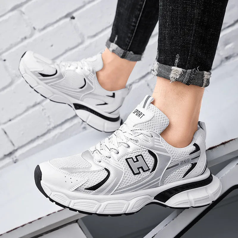 Men's mesh running shoes with plastic sole in black, white and grey, and white orange colour options