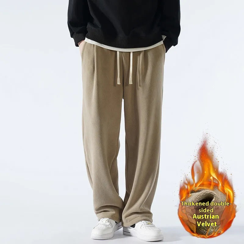 Men's apricot double-sided polar fleece-lined loose fit winter sports trousers on a hanger