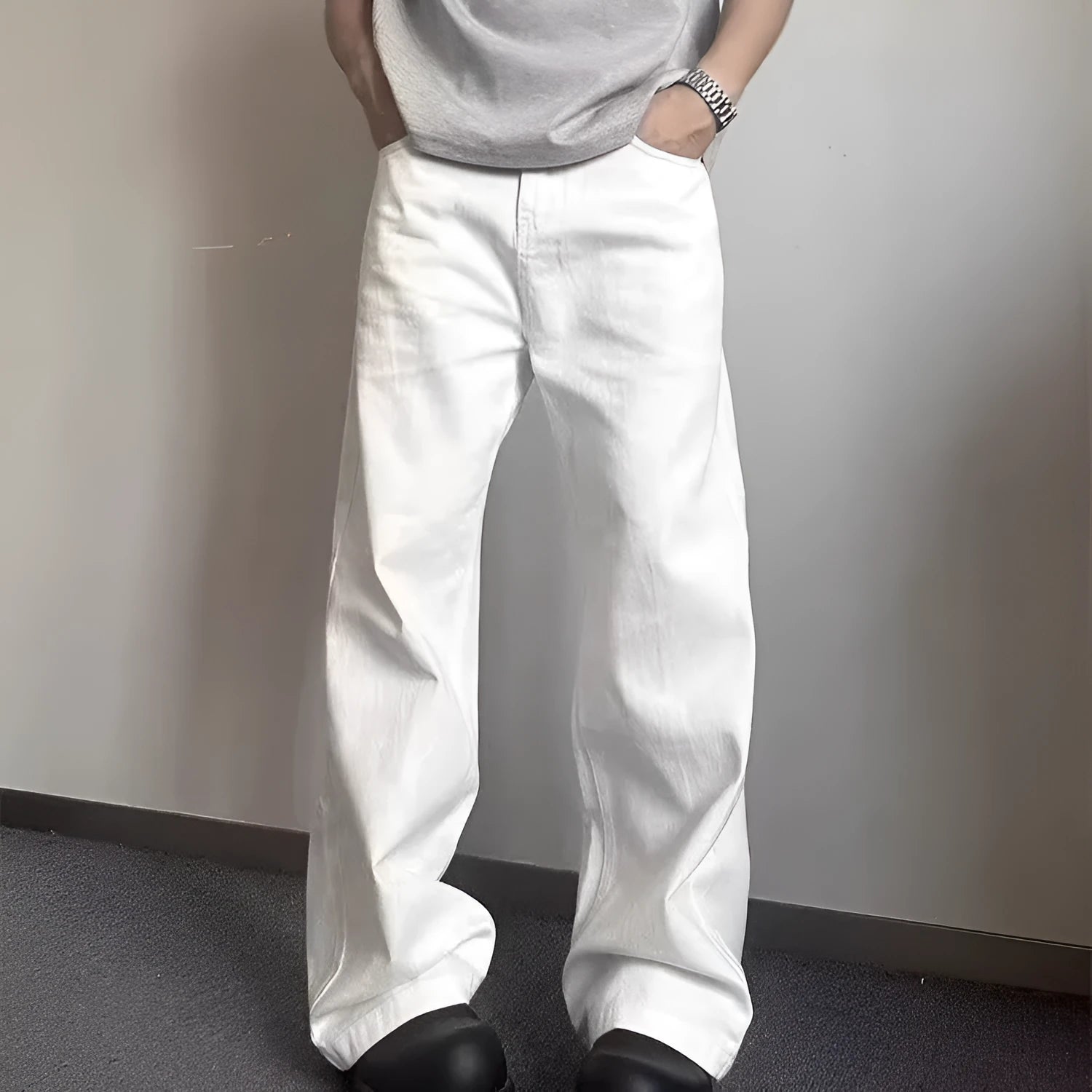 Men's straight leg white cotton denim jeans with wide leg opening and zipper fly