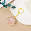 Natural crystal cat's paw keychain pendant in various gemstone colours including pink, red, blue and green crystals