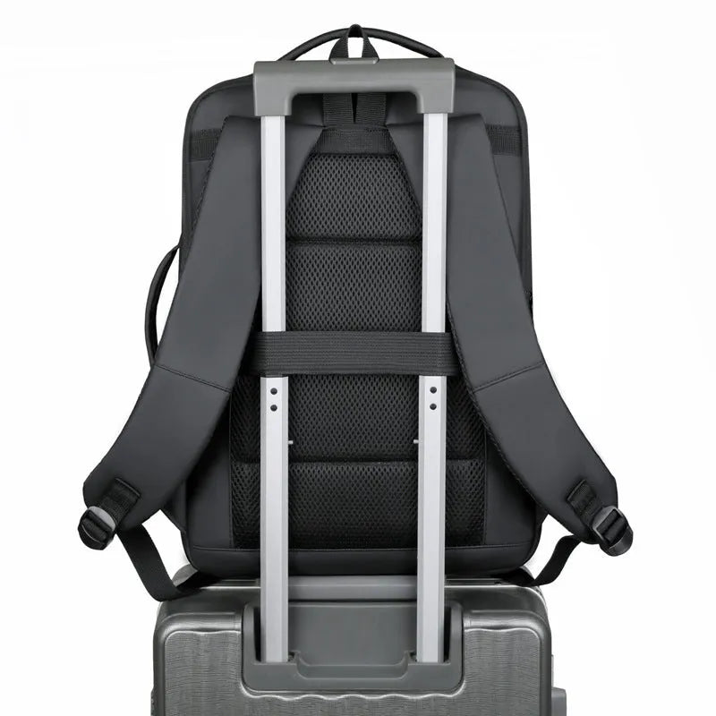 Large black waterproof Oxford cloth backpack with curved shoulder straps on a grey background.