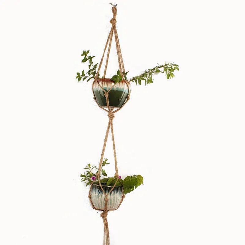 Woven wire basket with cotton rope, styled as a rustic desktop or wall-hanging planter for houseplants.