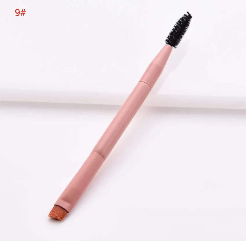 Ten professional makeup brushes with pink painted wooden handles and nylon bristles, including powder, foundation, and double-ended brushes.