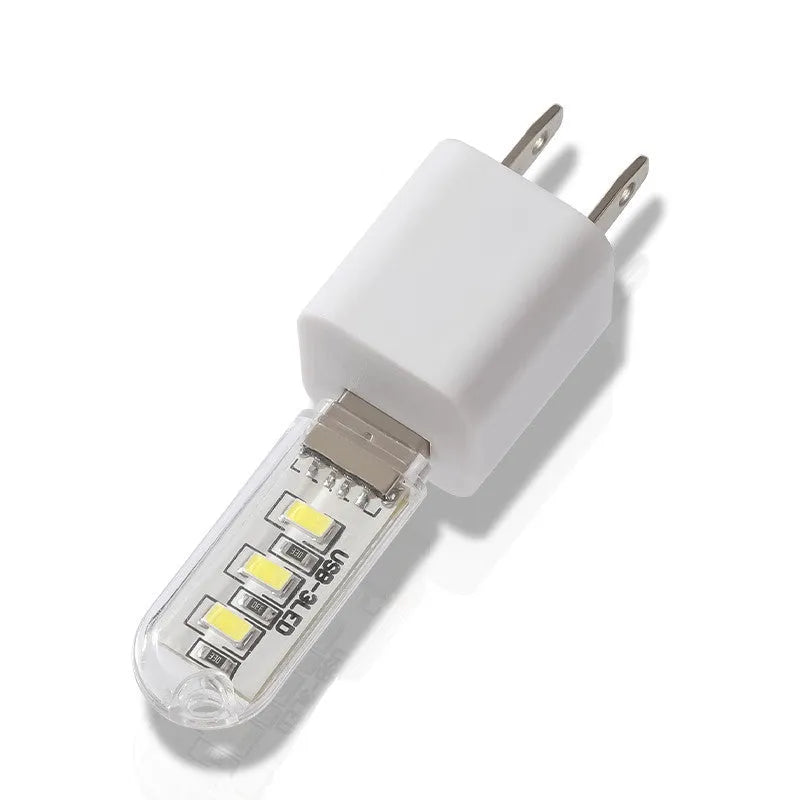 Compact white USB-powered LED baby night light with choice of warm or white light colour.