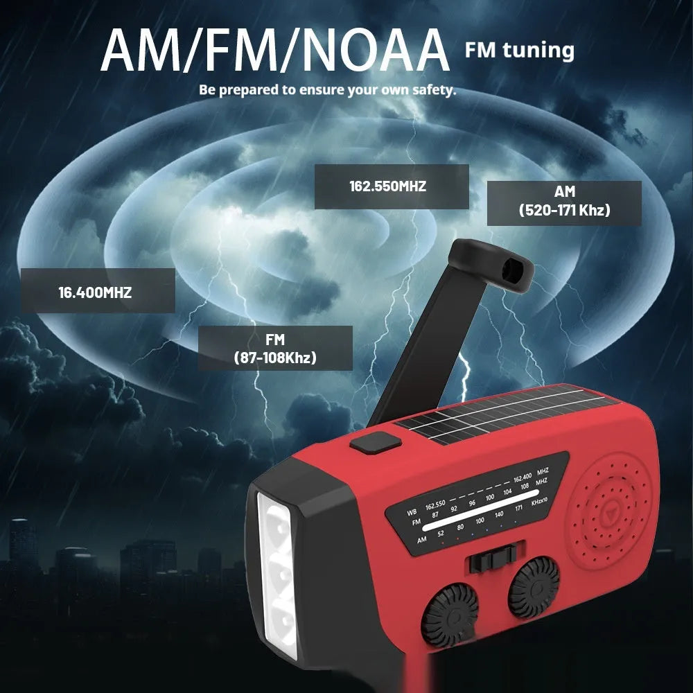 Red rechargeable emergency hand radio with torch, built-in speaker, USB port, and wrist strap.