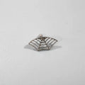Gold and silver spider web stud earrings with geometric mesh pattern