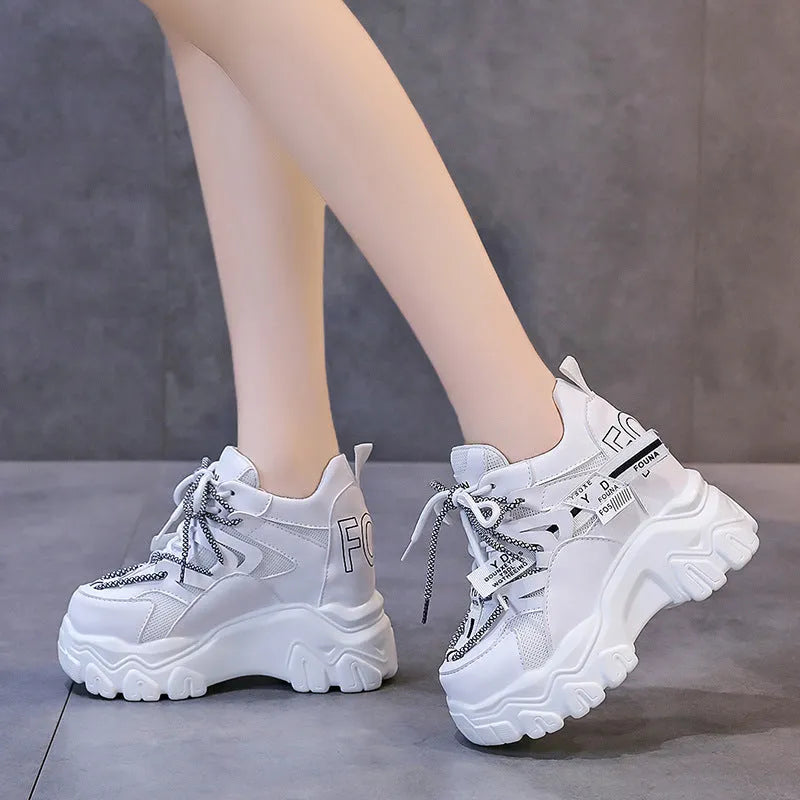 Women's white mesh platform sports shoes with cross-strap design and rubber sole
