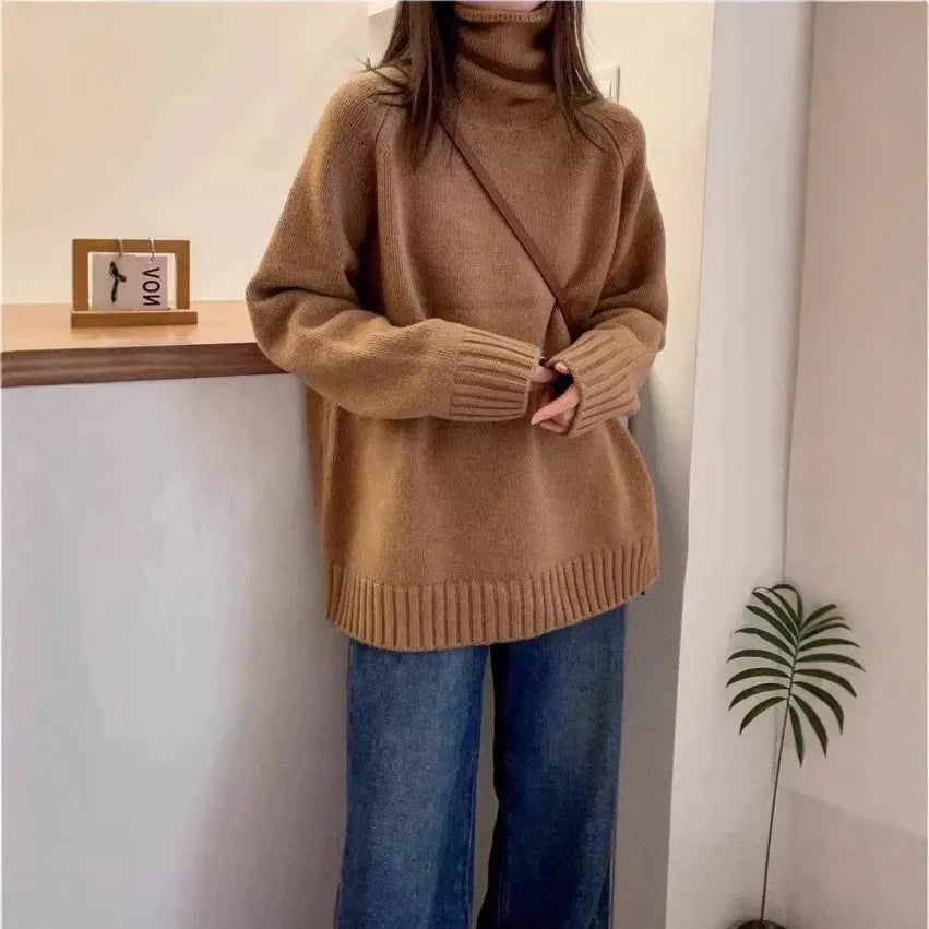 Women's loose turtleneck sweater in thick polyester mesh with curling pile collar, shown in solid colour.