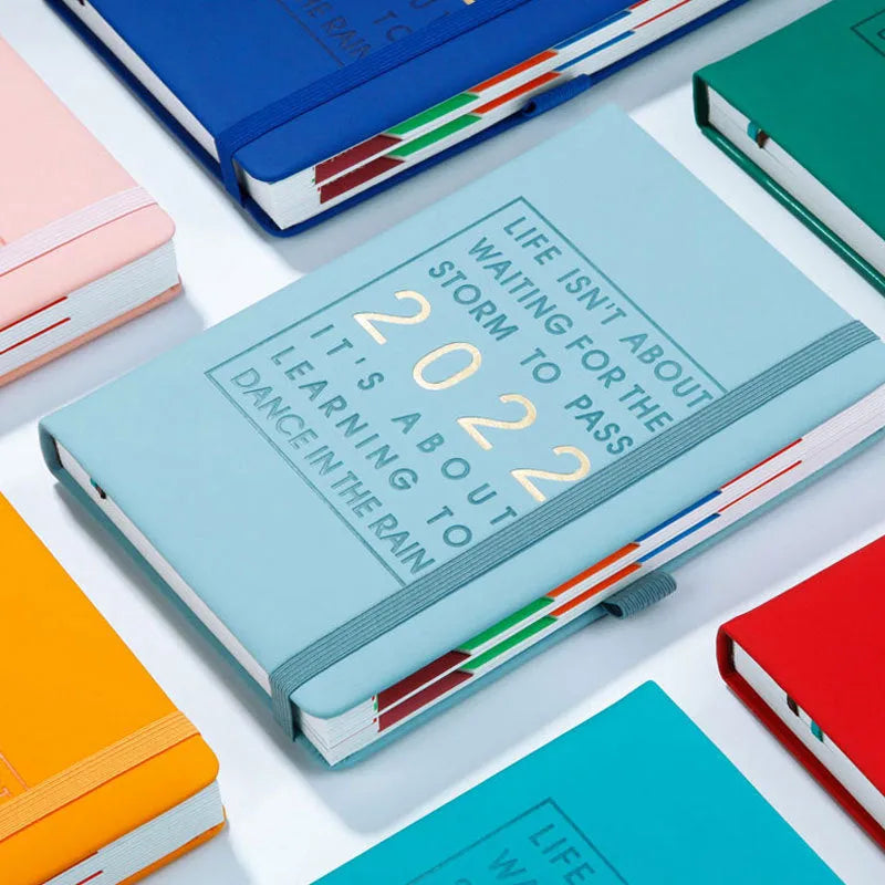 Imitation leather A5 notebook with French fold binding in red, purple, black, pink, sky blue, dark blue, and orange colour options
