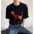 Men's grey cotton t-shirt with embroidered sausage dog and towel design showing round neck and short sleeves