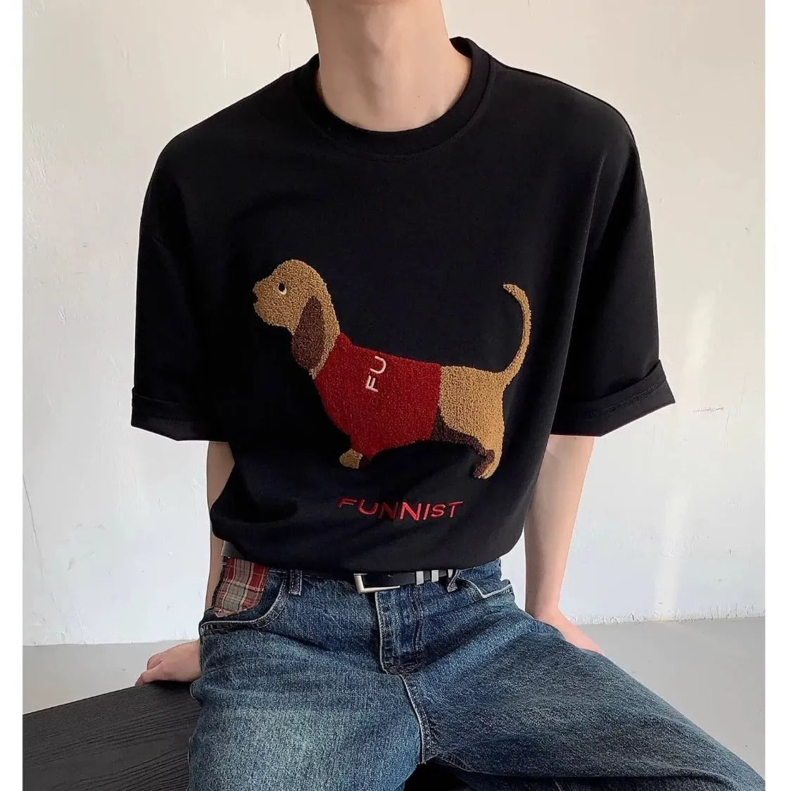 Men's grey cotton t-shirt with embroidered sausage dog and towel design showing round neck and short sleeves