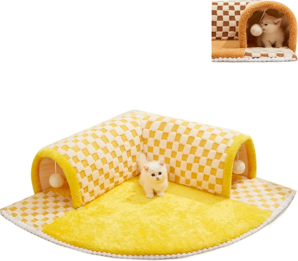 Brown plaid plush cat tunnel bed with a zippered side and central mat, shown on a wooden floor.