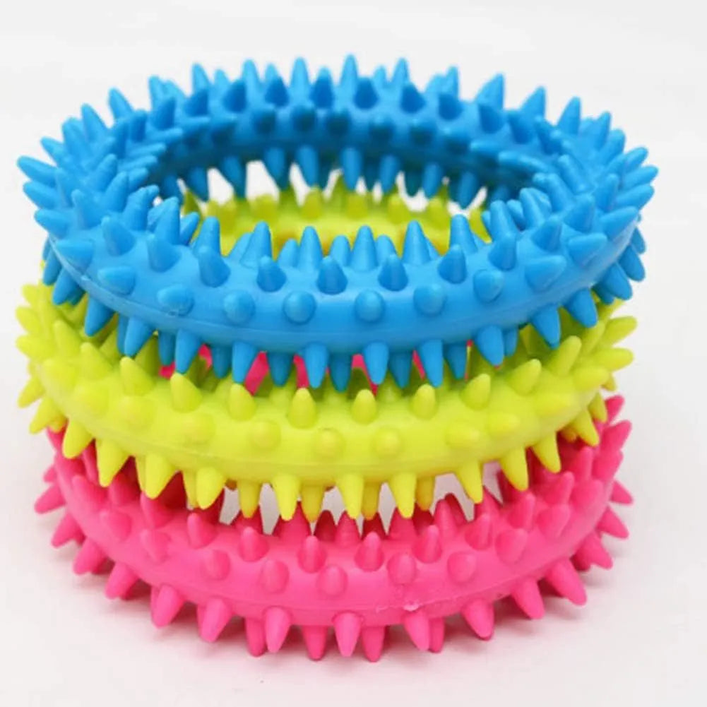 TPR spiky circle ring dog chew toy in various colours showing textured dental cleaning nubs