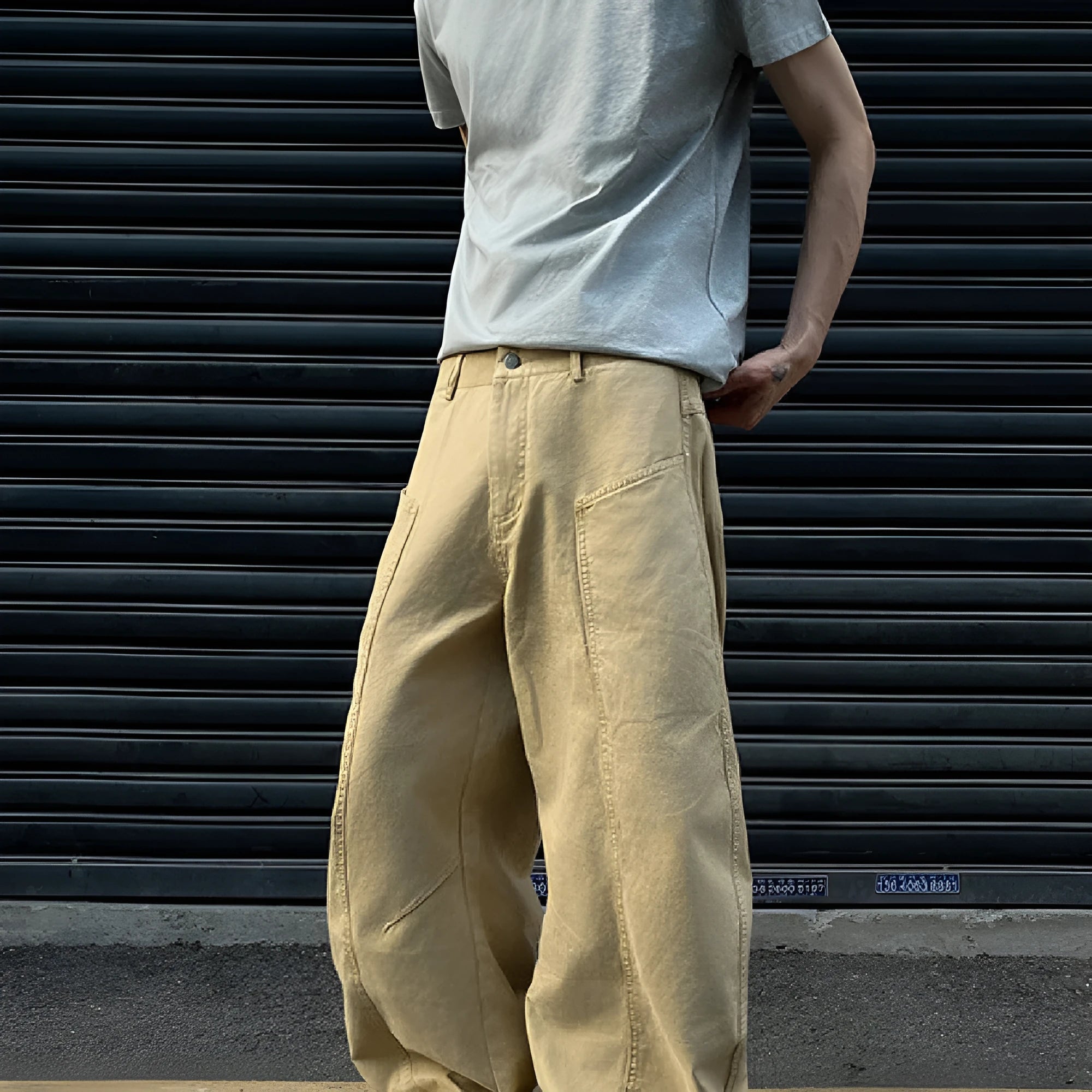 Men's khaki straight leg cotton trousers laid flat, showcasing the casual American retro style.