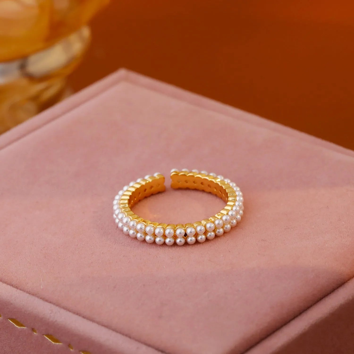Gold geometric open mouth women's ring with pearl detailing on copper base