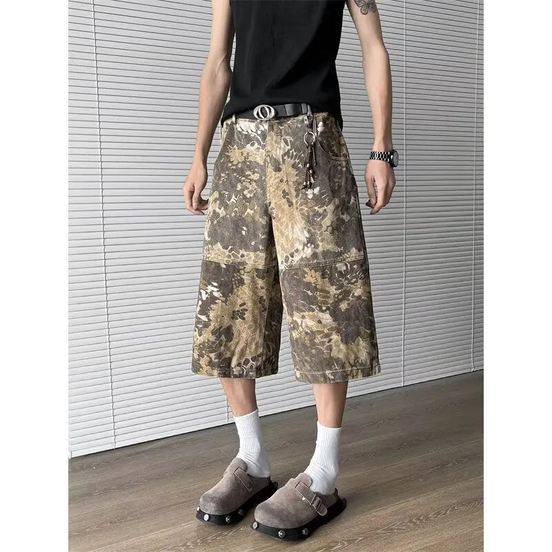 Yellow snake pattern camouflage cropped jeans on a denim background