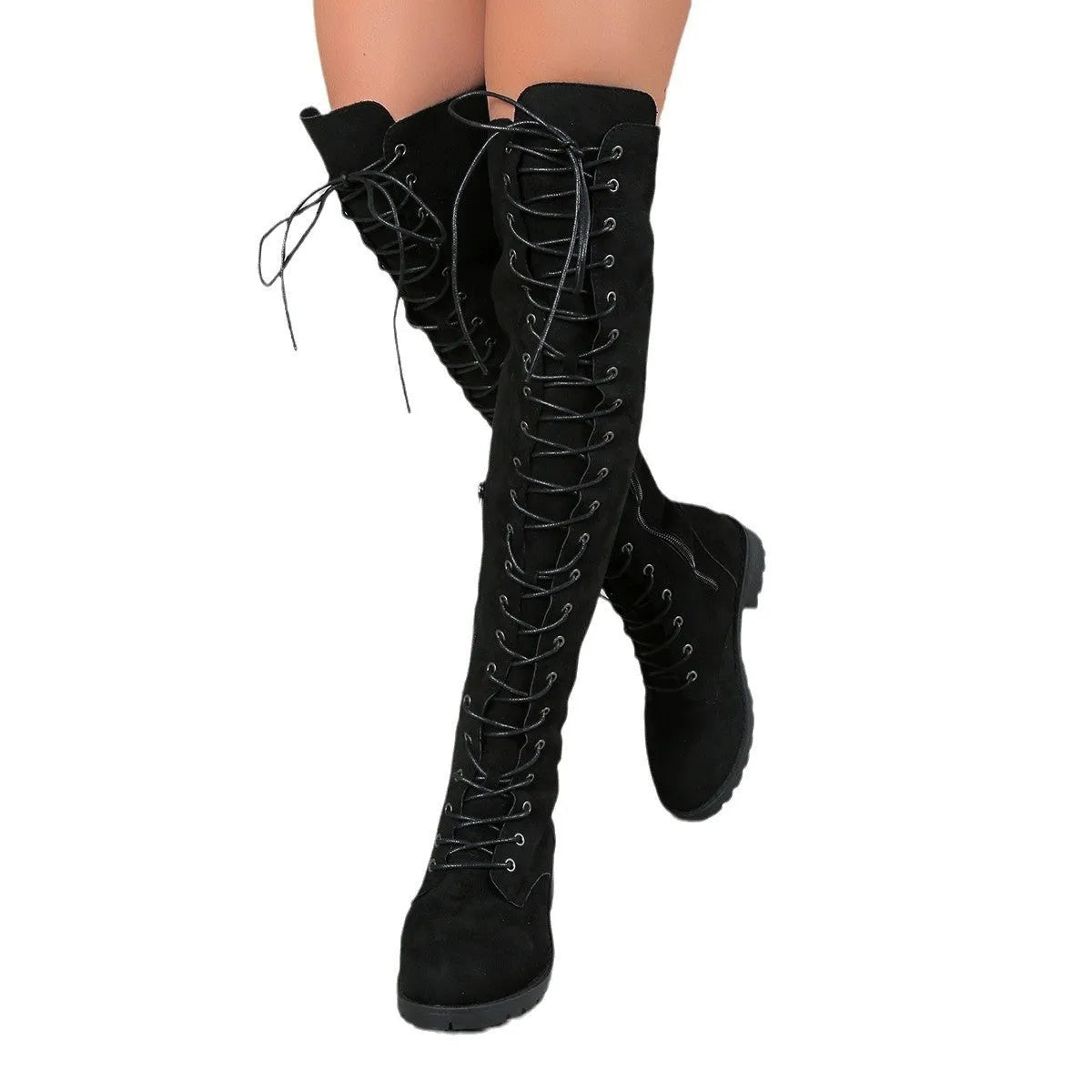 Black lace-up over-the-knee flat boots with round toe and stitching detail on a neutral background.
