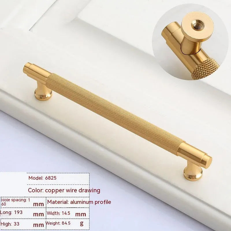 Aluminium furniture handle with brushed brass finish showing European style design