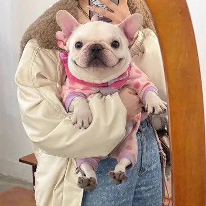 Pink polyester winter dog coat with hat option in sizes S to XxL shown casually on a pet