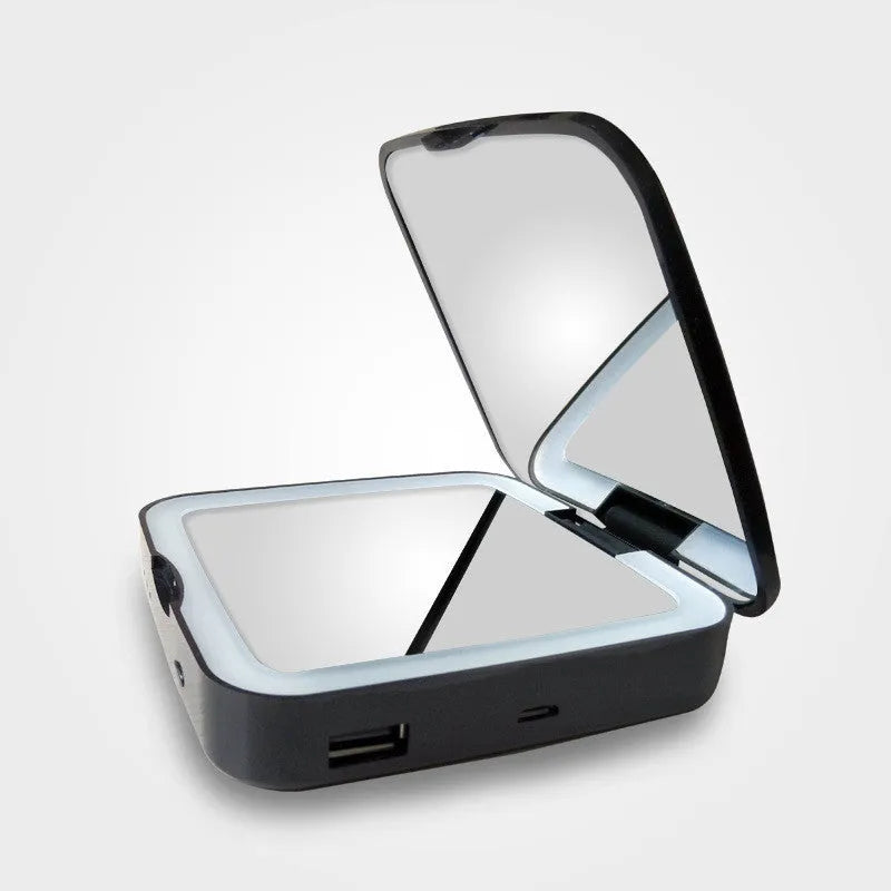 Makeup mirror with dual magnification and adjustable lighting in black or white colour options