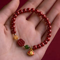 Emperor sandstone bracelet with fu character charm in 6mm and 8mm size options.