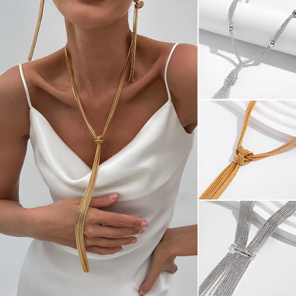 Simple Y-shaped metal tassel necklace with minimalist understated style, colour Gold, on display with matching earrings.