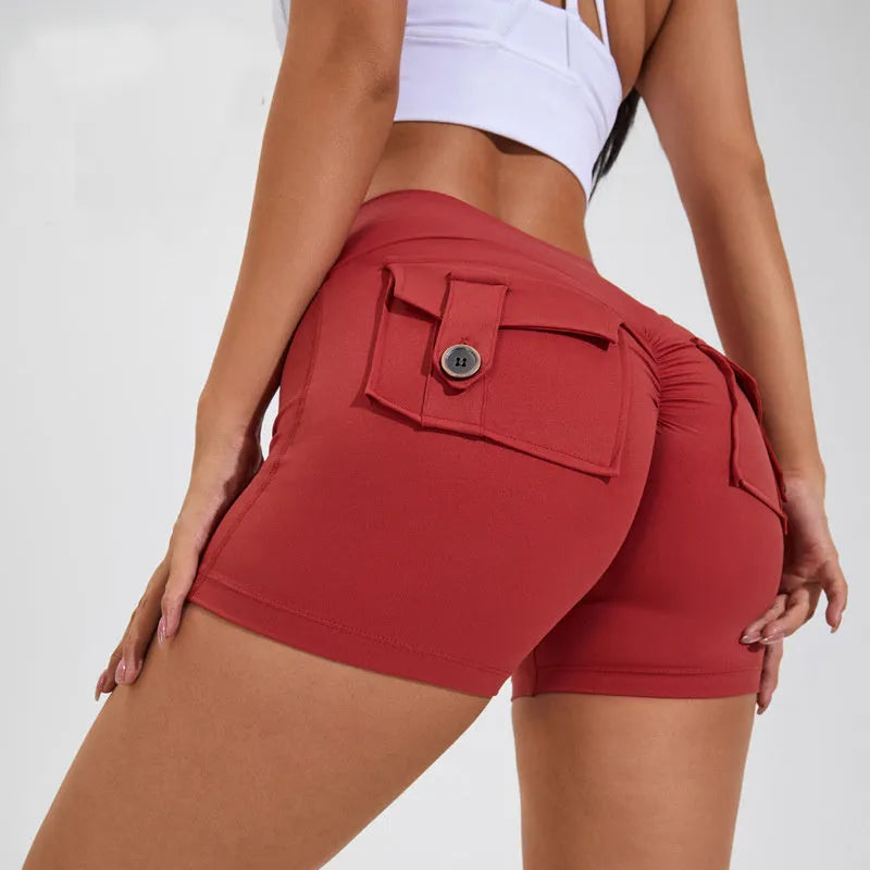 Women's high waist sport shorts in avocado green colour with pockets, on a mannequin.