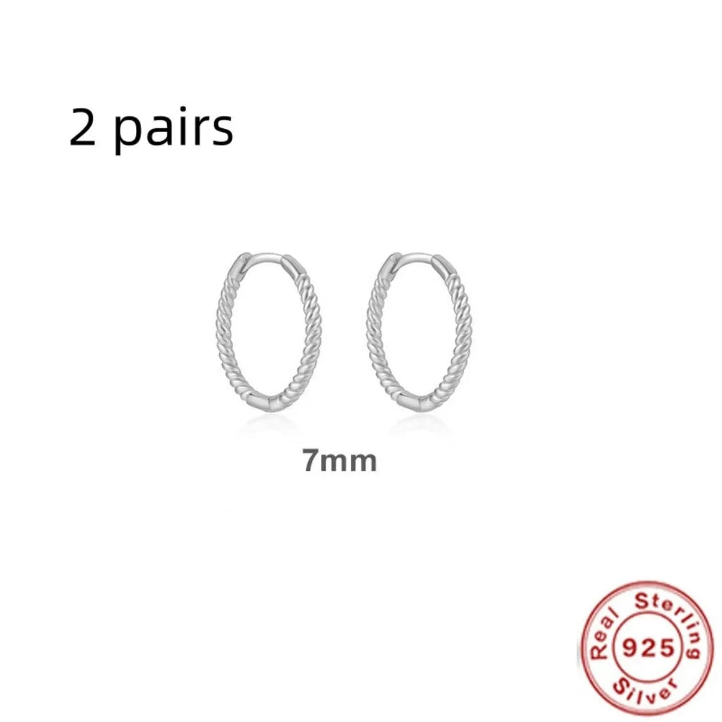 S925 sterling silver twisted string round ring stud earrings in gold and white gold finishes.