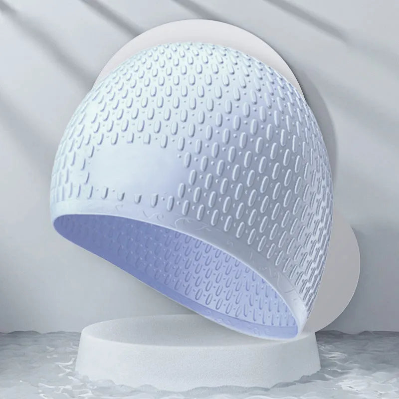 Silicone adult swimming cap in solid colour water drop design on white background.