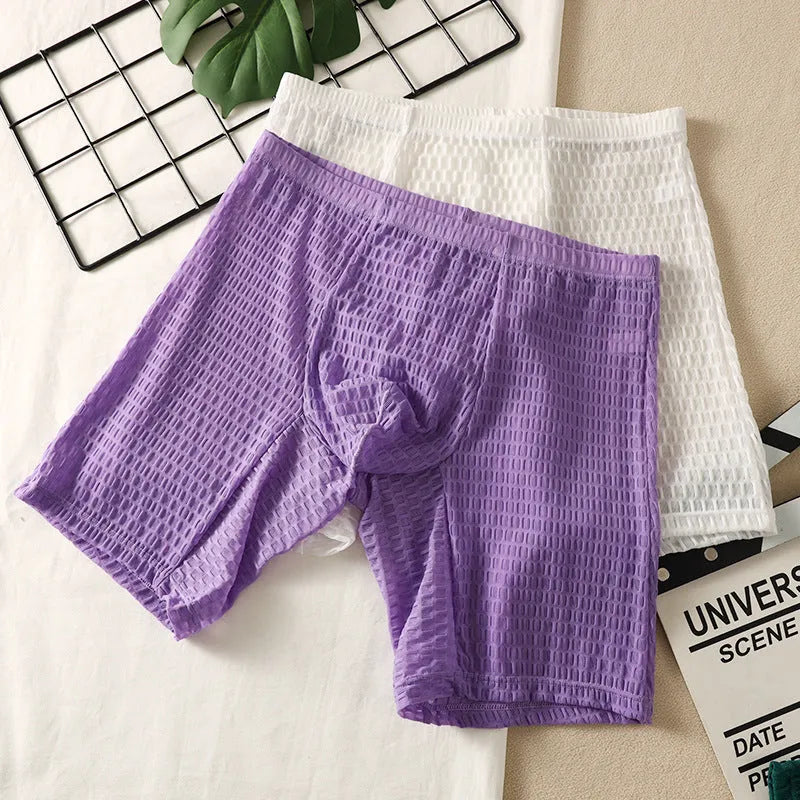 Men's solid colour lace shaping boxer underwear on a neutral background.