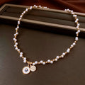 Women's gold electroplated necklace with round zircon-inlaid imitation pearl pendant on clavicle chain