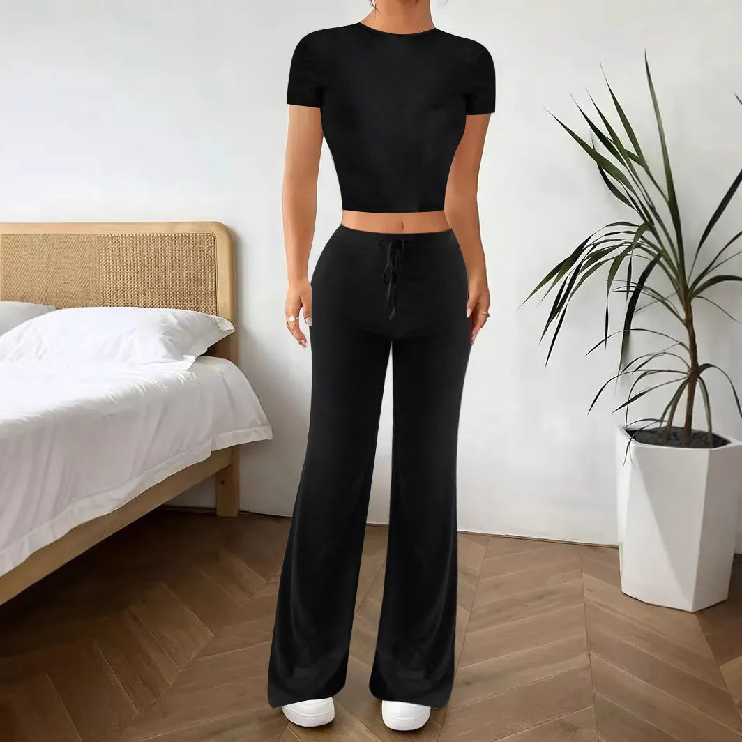 Black high waist trousers and short sleeve t-shirt women's co-ord set on a hanger