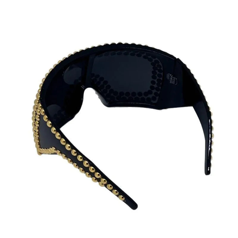 Men's punk style square sunglasses with large frames and silver rivet details