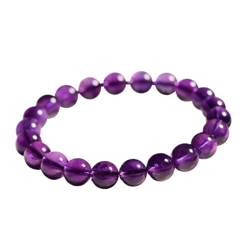 Natural amethyst scattered beads Uruguay bracelet in polished crystal on a white background.