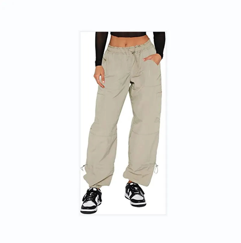 Men's loose-fit multi-pocket cargo casual trousers in polyester fabric on a hanger.