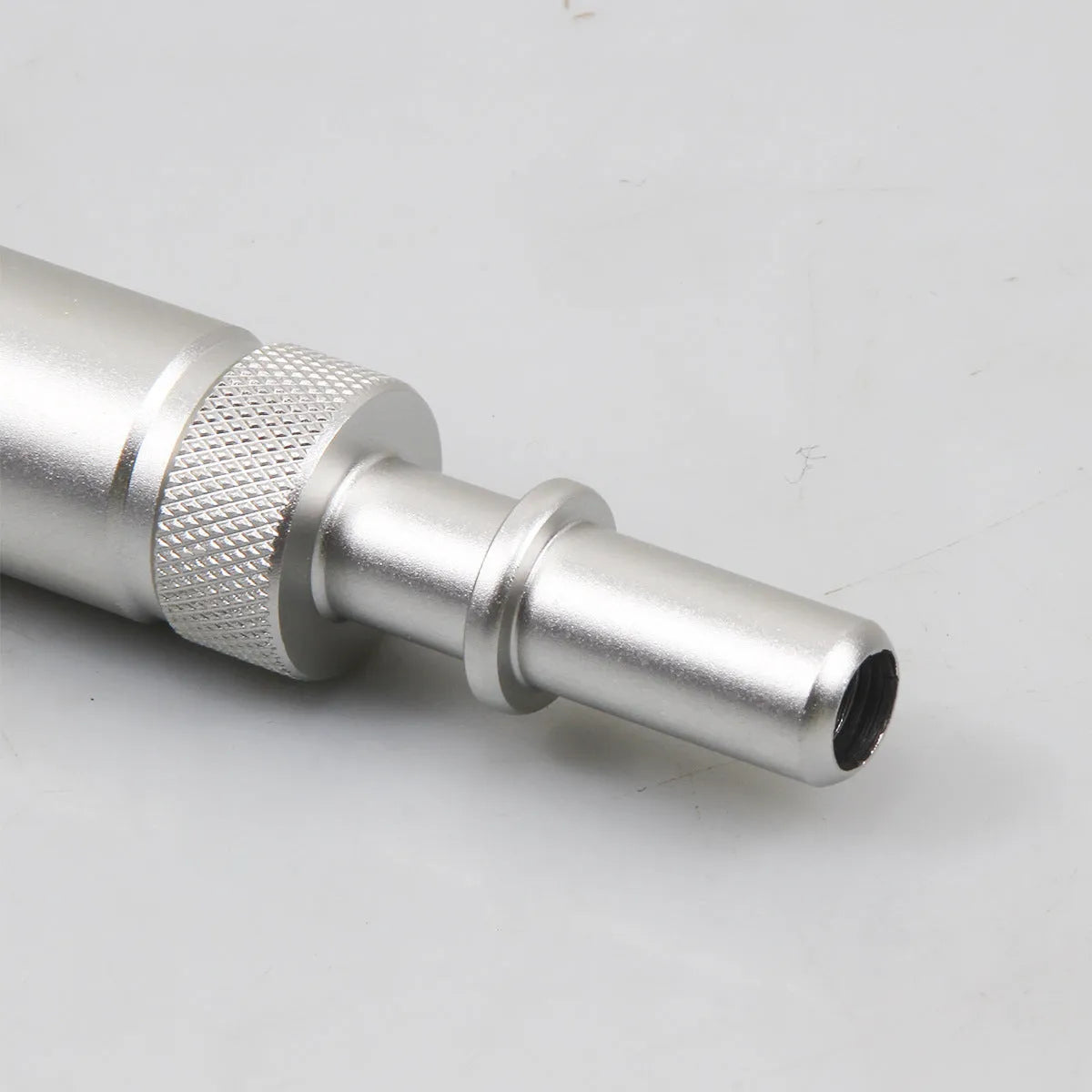 Silver metal VAS6262-9 transmission refuelling joint for automotive oil servicing.